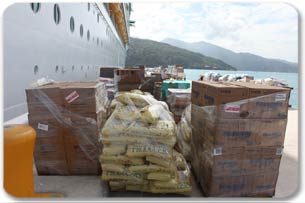 Pallets waiting to be loaded on to a truck to be distributed in Haiti.