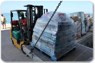 Forklift unloading relief supplies for Royal Caribbean