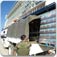 Palettes of water being loaded into a UN truck
