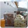 Pallets waiting to be loaded on to a truck to be distributed in Haiti.
