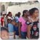 Haitians stand in line to collect water